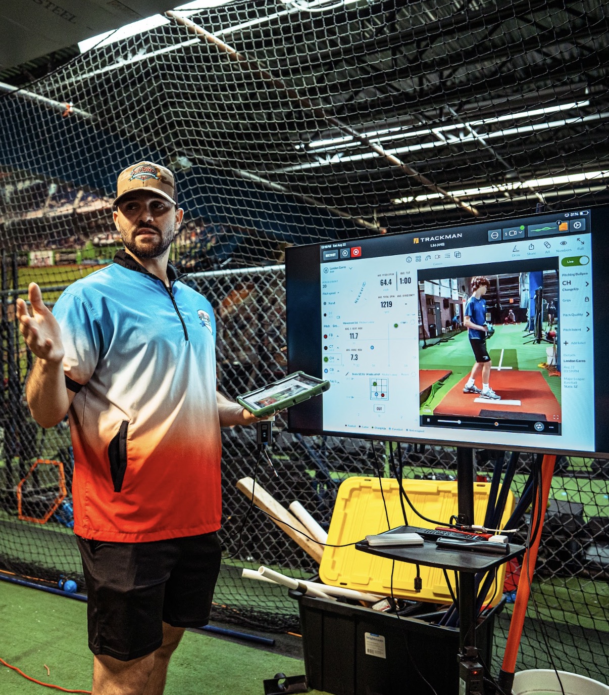 Pitching coach reviewing a TrackMan bullpen evaluation at All Star Training Center